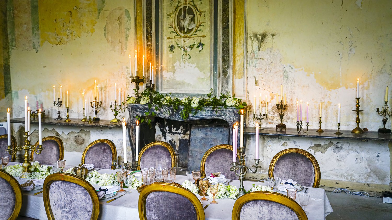 The dining room, laid by candlelight