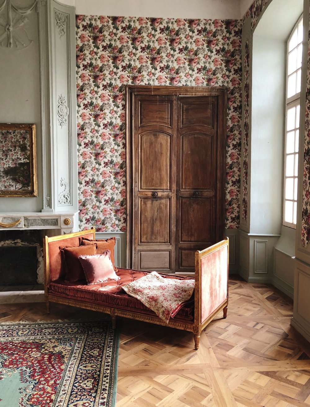 The floral bedroom of the Family Suite