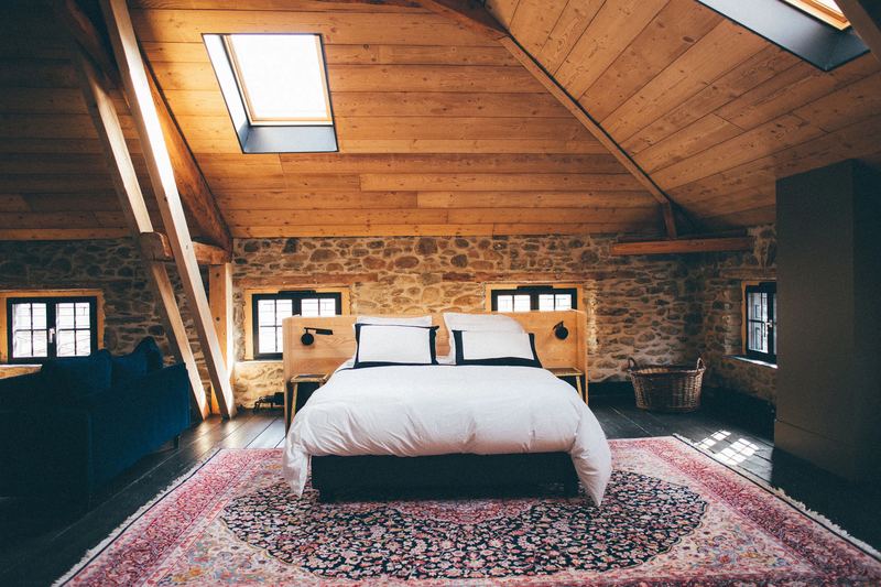 A room at Maison Beaucoup, under the roof timbers