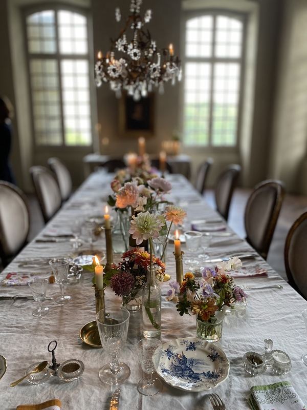 A long table under the chandelier